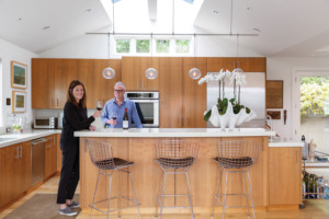 Lisa and Chuck enjoying libations in their kitchen in their new Mill Valley home.