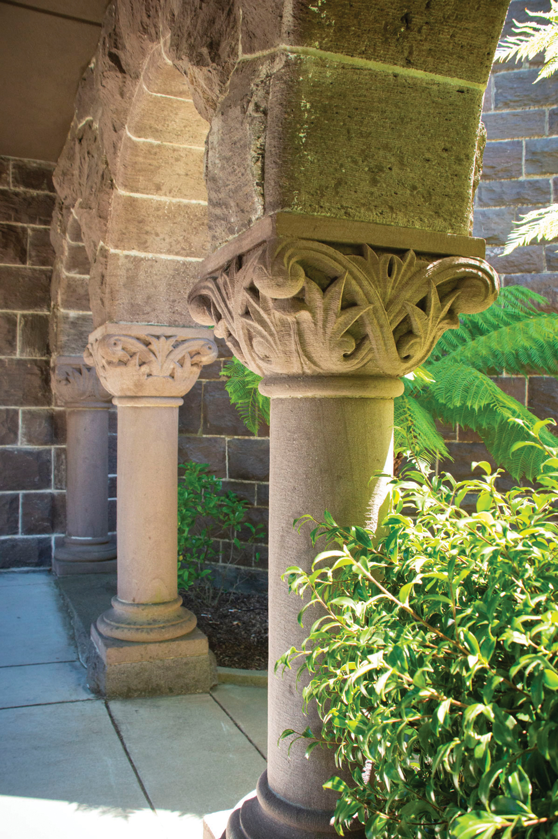 A loggia lined with Romanesque arches connects the chapel to Montague Hall.